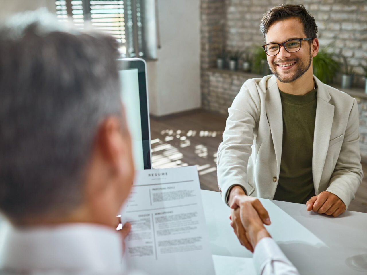 https://alnoor-co.com/wp-content/uploads/2024/01/happy-male-candidate-greeting-member-human-resource-team-job-interview-office-1280x960.jpg